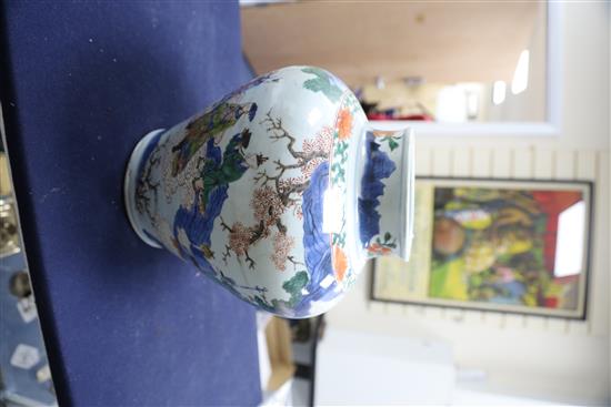 A Chinese wucai baluster vase, Transitional period c.1640, H.28cm, restorations